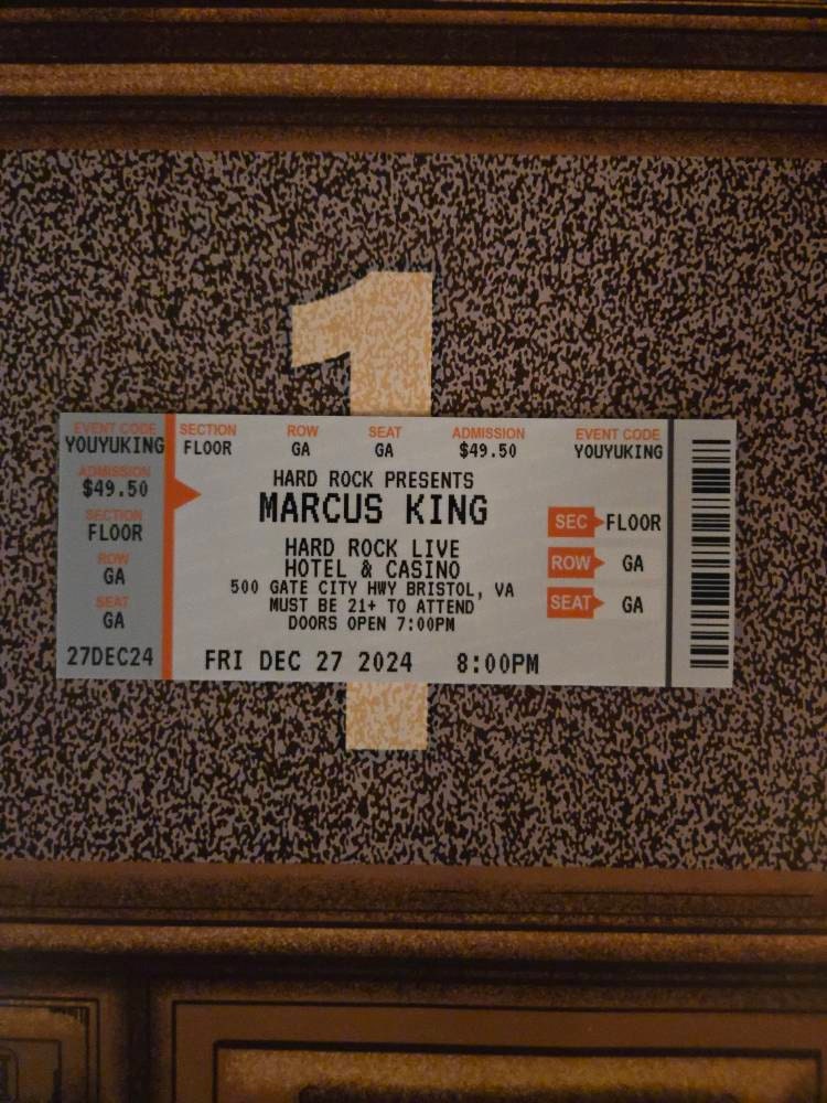 A custom KeepTix ticket displayed in a frame