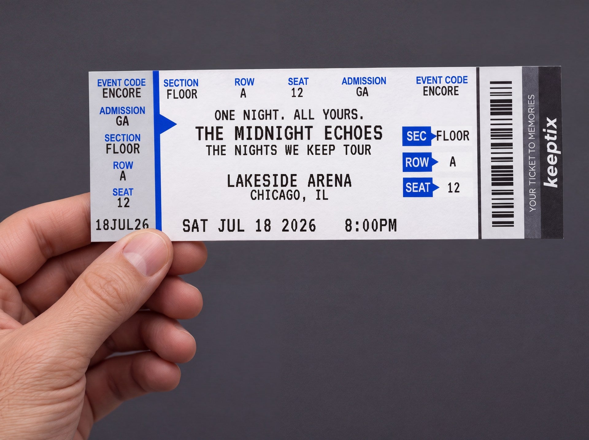 A hand holding a physical blue KeepTix souvenir concert ticket
